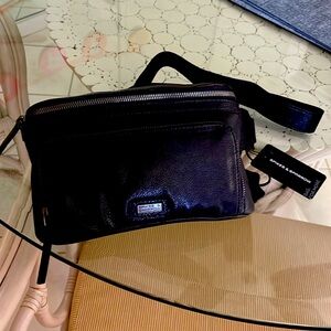 This is brand new blk leather cross body belt bag!
